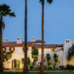Steven Spielberg house featuring a luxury estate exterior with elegant architecture, premium landscaping, and twilight lighting.